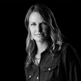 Portrait photo of Renee Steven in black and white.